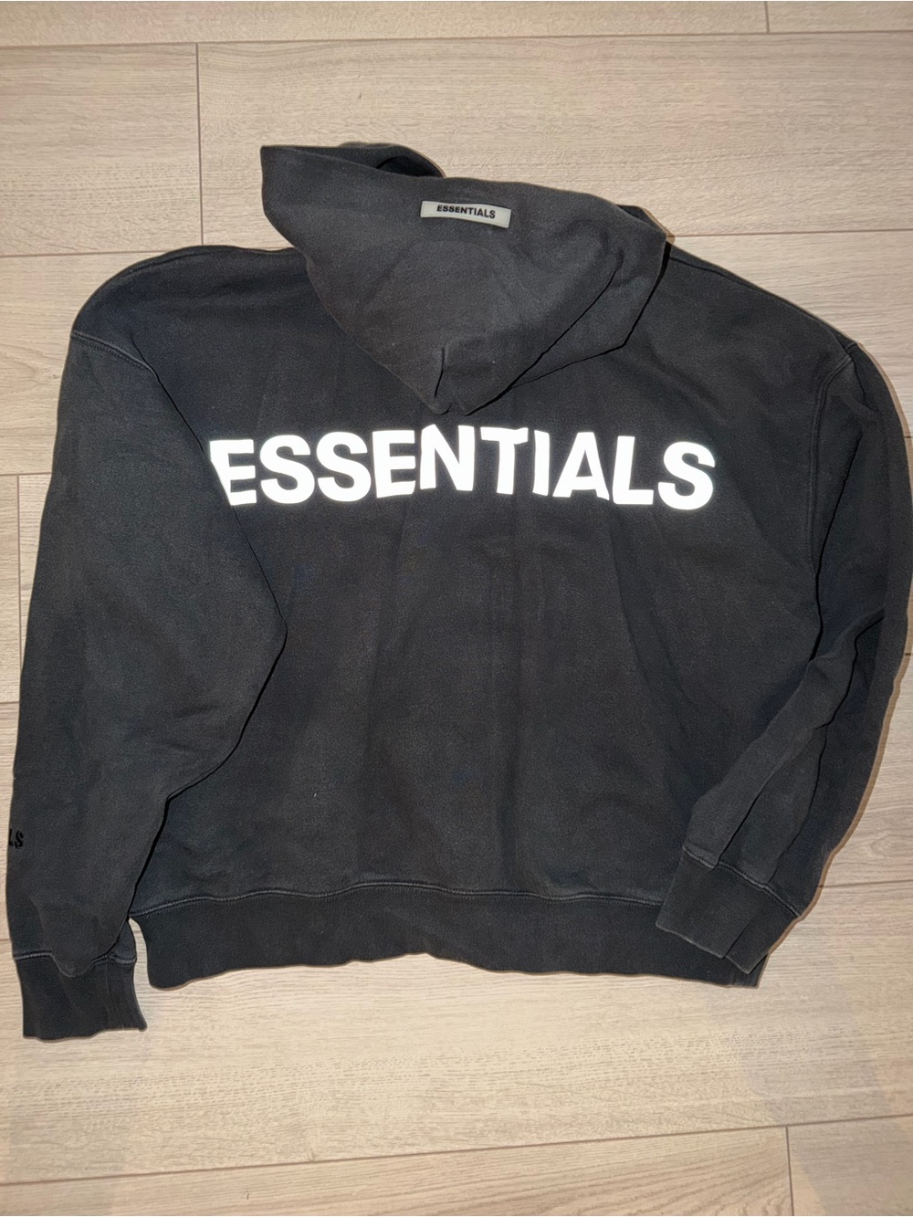 Essentials Black Hoodie with White Back Logo